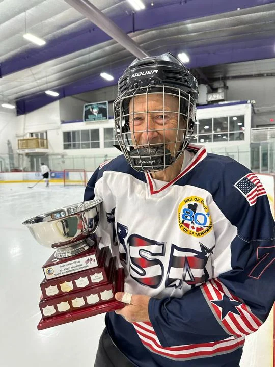 Bob Priestley holding the championship trophy
