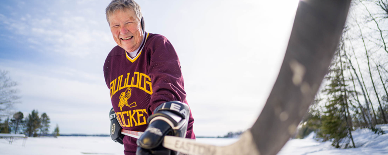 Bonnie Shea skating on the lake in her Bulldogs jersey