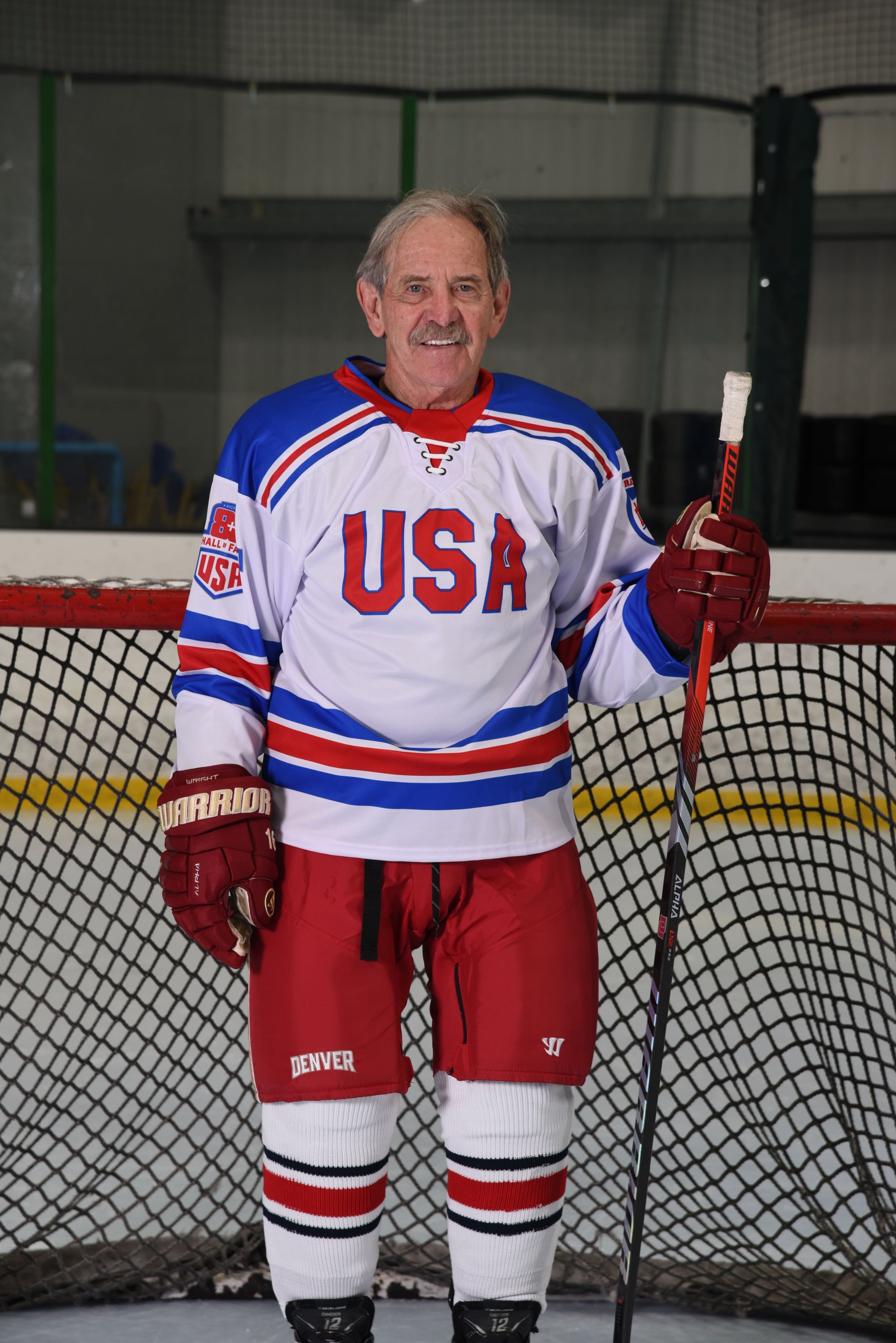 Don Cameron standing with teammates