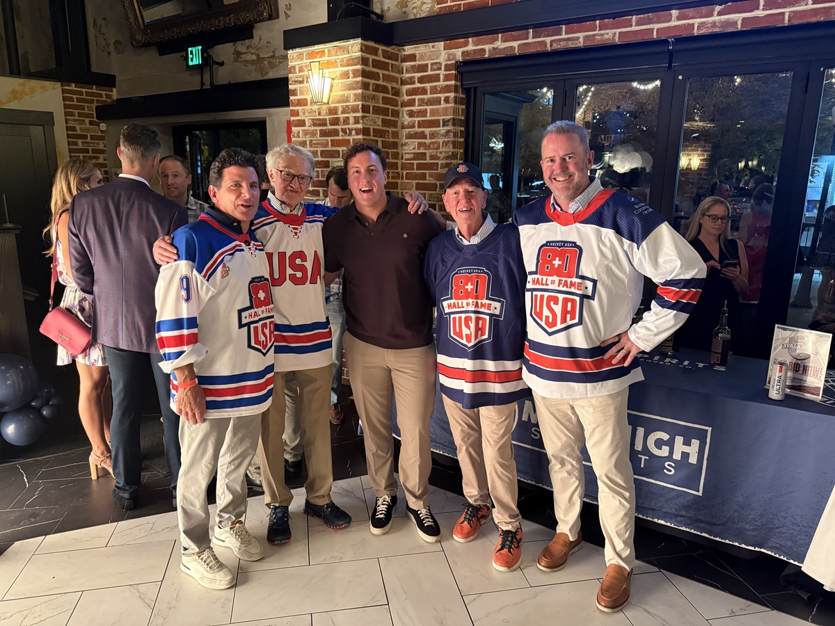 Pat Long and Fred Merchant with the group at the Colorado Avalanche Alumni vs University of Denver Alumni game