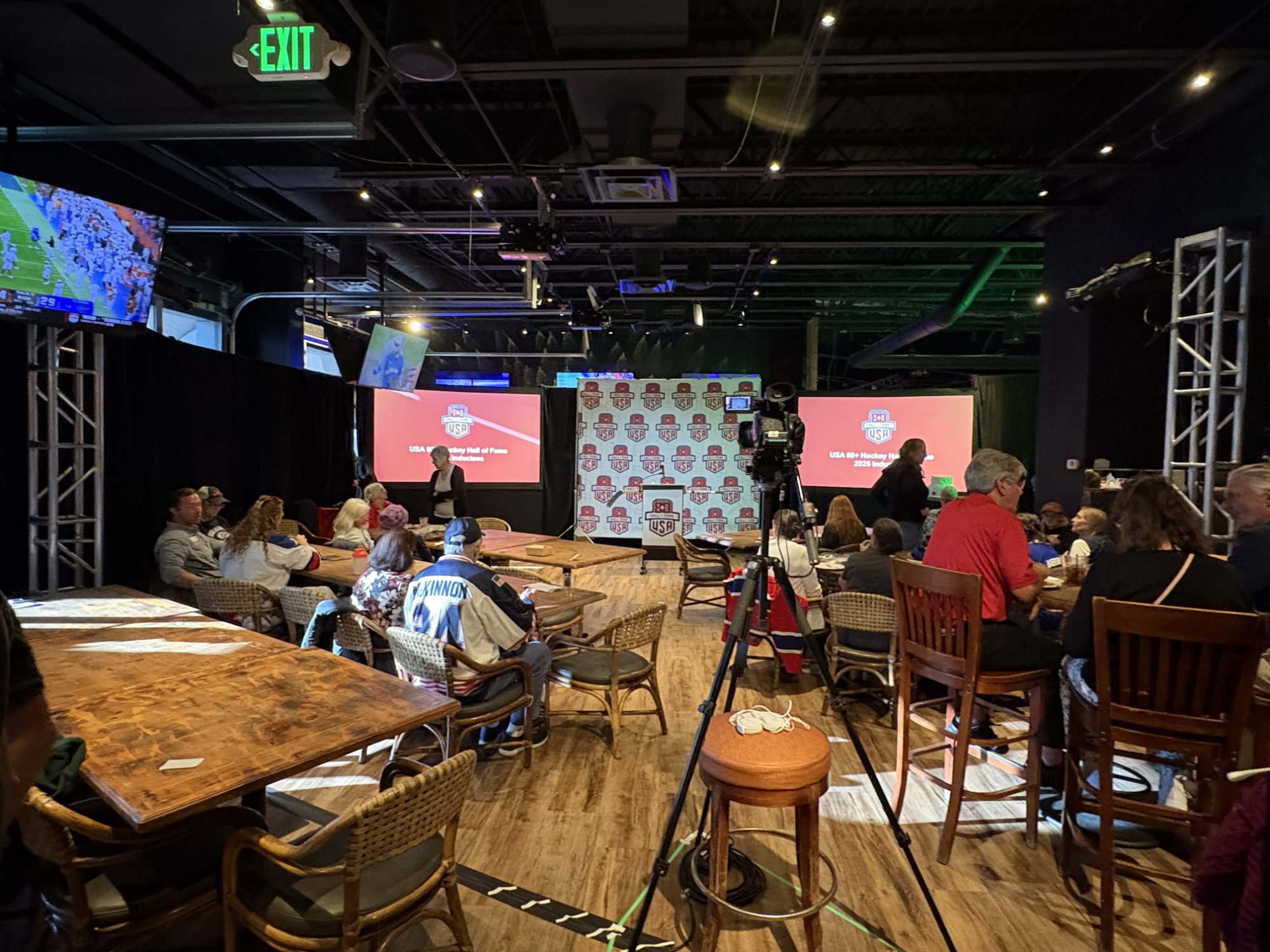 The banquet venue with HHOF backdrop, drapes, screens, and video equipment