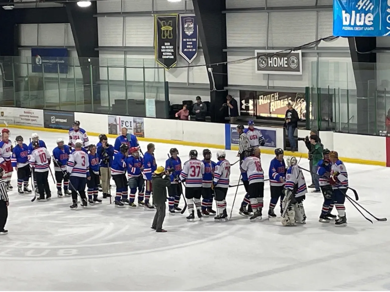 Players shake hands after the Legends Game